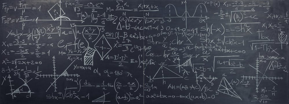 A chalkboard displaying a giant mathematical formula